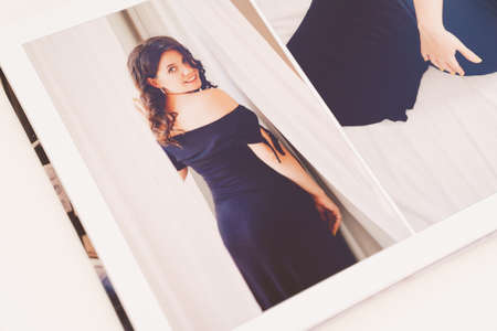 the pages of a photobook with a beautiful pregnancy photo shoot.の写真素材