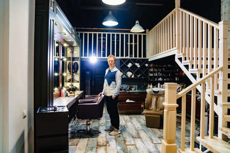 male hairdresser and stylist barbershop worker. small businesses.の写真素材