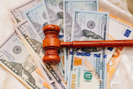 the judges hammer on the banknotes. judicial corruption and justice. dollarsの写真素材