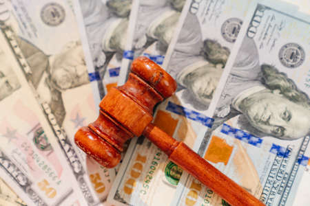 the judges hammer on the banknotes. judicial corruption and justice. dollars