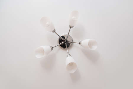 classic ceiling lamp with white lampshades. lighting fixtures.