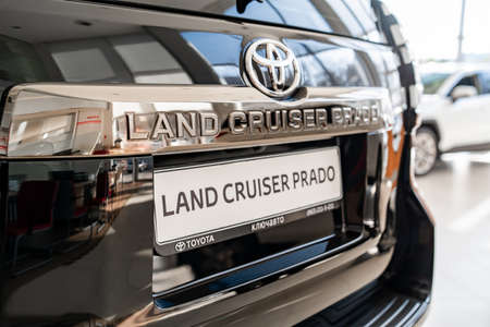 rear view. new black car white Toyota land cruiser prado in dealershipのeditorial素材