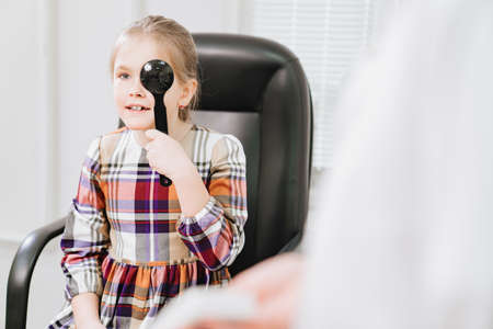 vision diagnostics a little girls. clinic of treatment and correction of vision