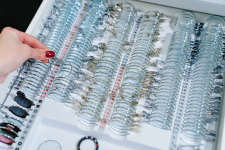box with a set of test spectacle lenses for the examination. ophthalmologist