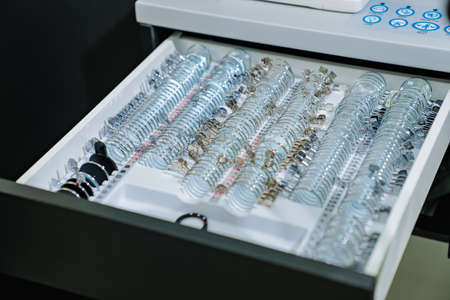 box with a set of test spectacle lenses for the examination. ophthalmologist