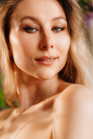portrait of a young blonde woman with bare shoulders.の写真素材