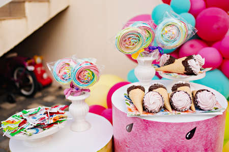 candy bar. desserts in a waffle cone and marshmallows on a stick.の写真素材