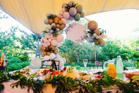 space for the inscription. decoration over the table for banquet of balloons.の写真素材