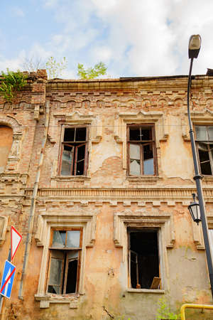 ruins. broken glass in windows of an old ruined building.