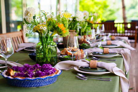 beautiful setting of a large table with flowers.の写真素材