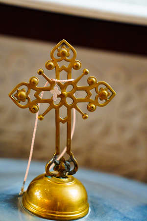 orthodox cross on the lid of the baptismal font in Orthodox Church.