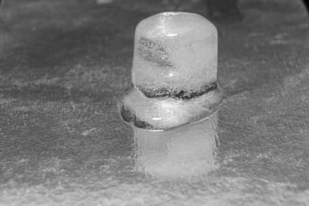 the process of melting an ice cube. black-and-white.の写真素材