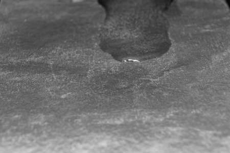 puddle after melting an ice cube. black-and-white.の写真素材