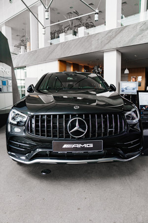 a black Mercedes AMG car in the parking of a car dealershipのeditorial素材