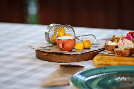 delicious snacks. meat, cheese, sauces and sandwiches with pate and vegetables.のeditorial素材