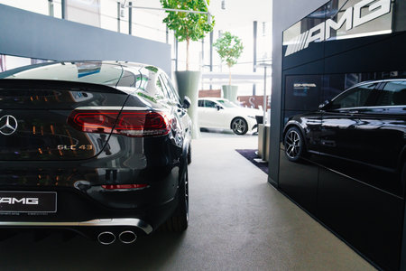 parking and interior of the Mercedes car dealership. sale of new cars on credit.のeditorial素材