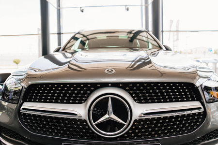 logo and grille radiator. part of a grey Mercedes GLB car.のeditorial素材