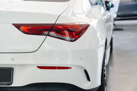 tail light of a white Mercedes car in the parking of a car dealershipのeditorial素材