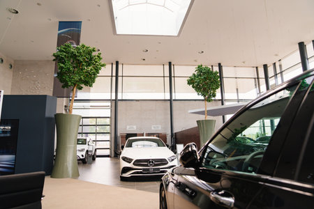 parking and interior of the Mercedes car dealership. sale of new cars on credit.のeditorial素材