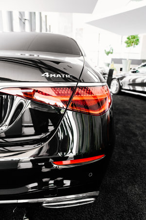 tail light of a black Mercedes 4matic car in the parking of a car dealershipのeditorial素材