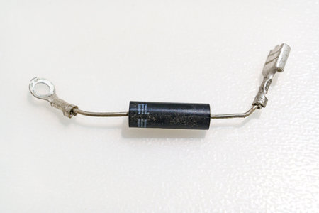High-voltage diode on a white background. Microwave oven detail.