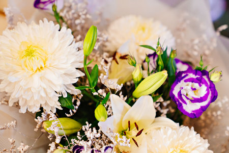view from above on a bouquet of white and purple delicate flowers.の写真素材