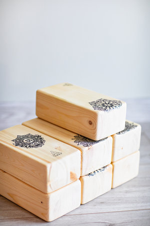 wooden yoga blocks on the floor in the gym. Yoga bricks.