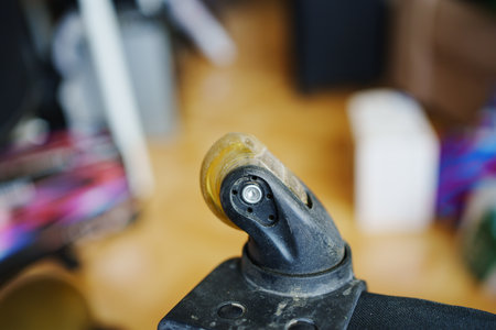 an old dirty broken wheel from a black travel suitcase.の写真素材