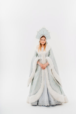 Snow Maiden in a traditional costume with a kokoshnik on a white background.の写真素材