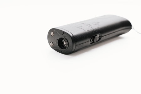 Ultrasonic dog repeller for protection and training on a white background.の写真素材