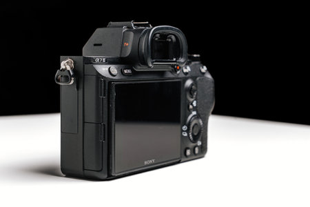 viewfinder and display of Black mirrorless Camera Sony on a white table.