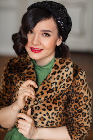 portrait of beautiful and happy brunette in retro clothes and beret.の写真素材