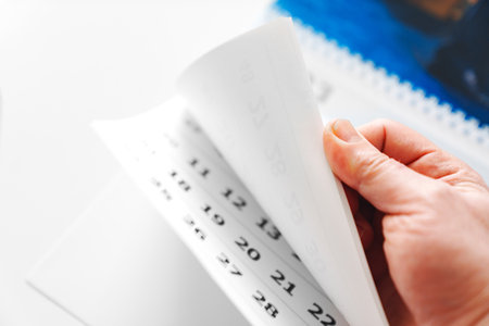 flipping through the pages of the flip calendar.の写真素材