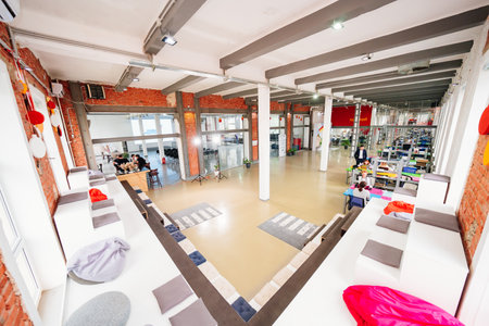 modern office space with benches and bean bag chairs.のeditorial素材