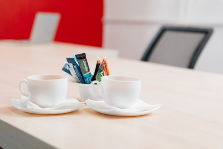 two white cups of tea on the table. the concept of a break at work.のeditorial素材