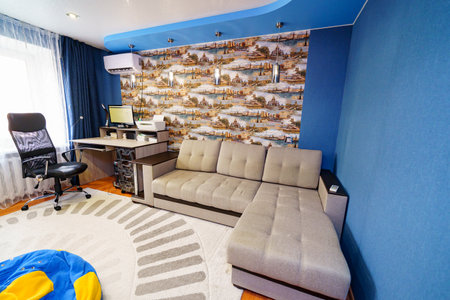 interior of the room with corner sofa, Desktop with computer and printer.のeditorial素材