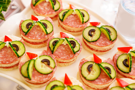 sandwiches with sausage and cucumber for children. childrens holiday menu.の写真素材
