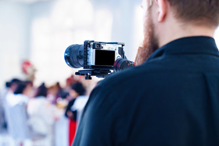 Video shooting on a professional camera of a big holiday in a restaurant.