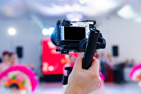 Video shooting on a professional camera of a big holiday in a restaurant.