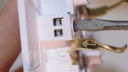 Connecting the ground wire to an electrical outlet. safety of use of electrical