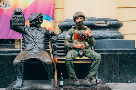 a soldier on a bench with a sculpture of a clown at a circus in Rostov-on-Don