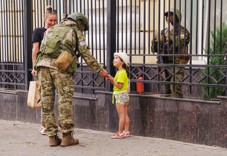 Military and kid on streets of during attempted military coup in Rostov-on-Donのeditorial素材