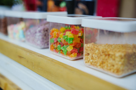 plastic containers with confectionery powders and decor for dessertsの写真素材