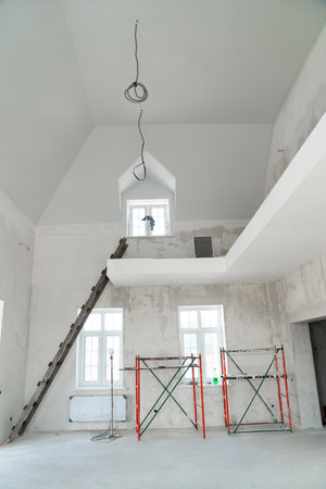 A room in a two-story house under construction. repair and construction works.の写真素材