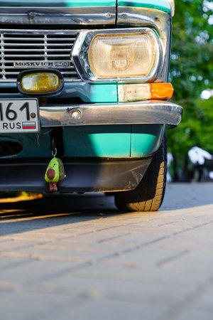 part of Vintage old turquoise Moskvich car. Soviet automobile industry.