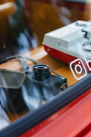 Retro camera in the interior of a vintage car.のeditorial素材