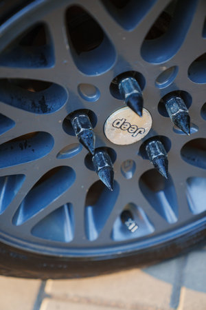 Retro jeep wheels with spikes. Car accessories.