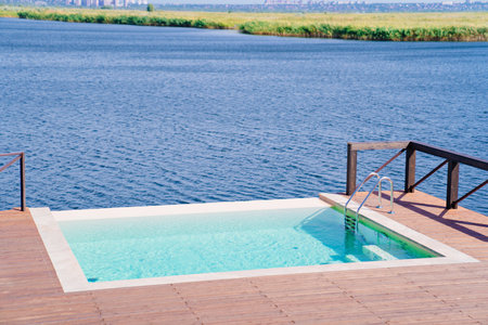 Terrace with swimming pool by the river.の写真素材