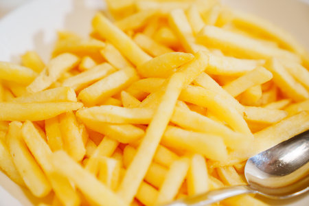 A plate of french fries. favorite fast food food.の写真素材