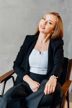 Beautiful businesswoman in black business suit.の写真素材